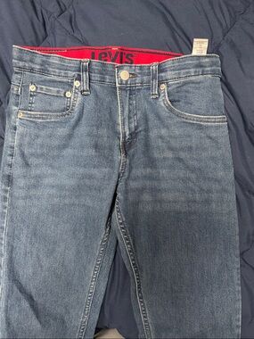 Levi's Light Blue Straight Jeans with Subtle Red Waistband Detail
